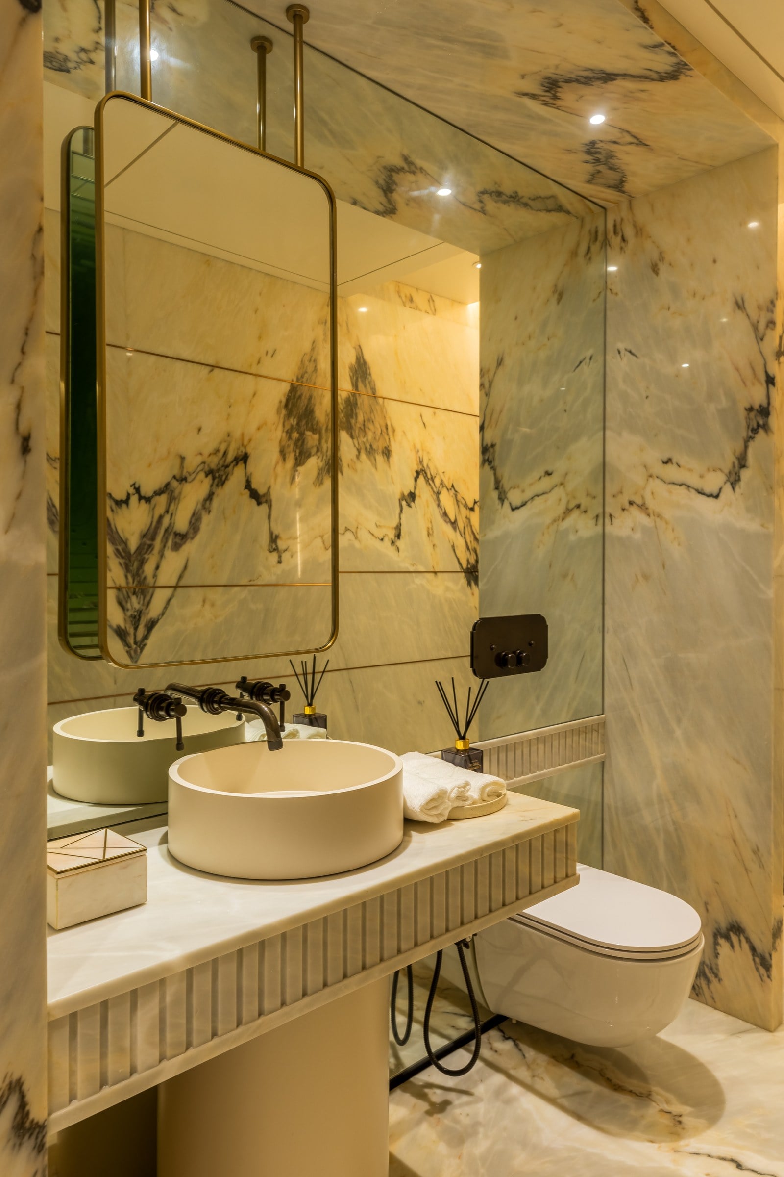 Marble powder room in the show residence at The Imperial i
