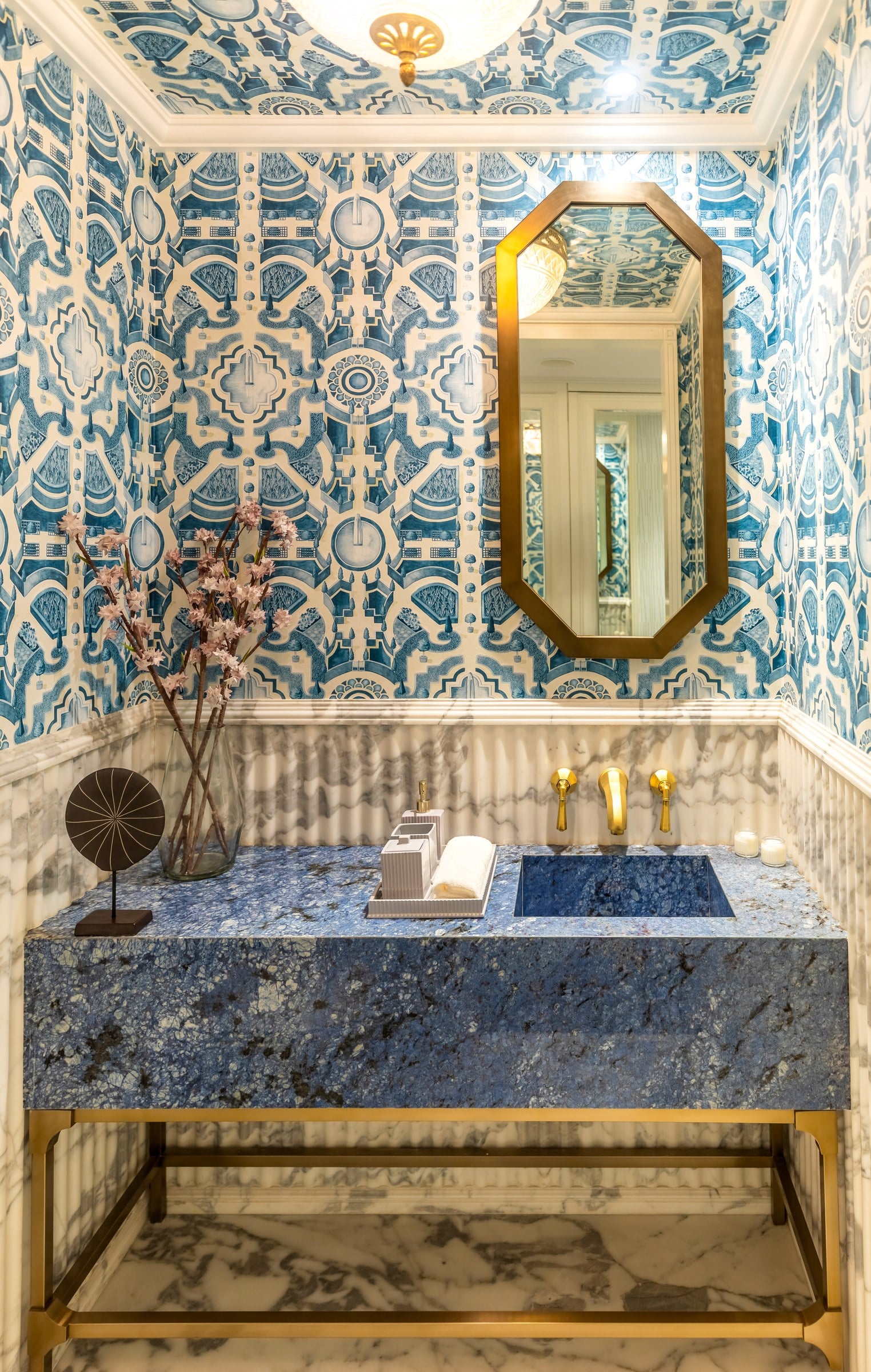 Blue-patterned powder room in the show residence at The Imperial i