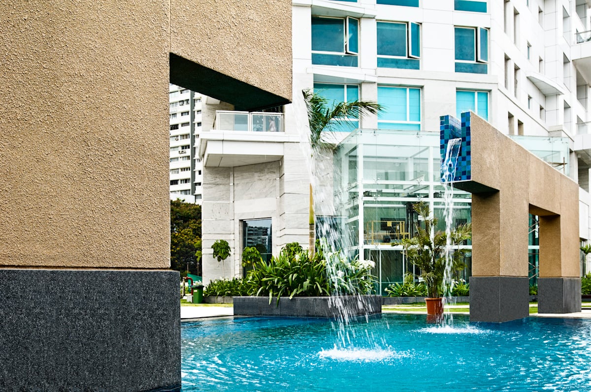 Outdoor pool and water features at The Imperial Towers