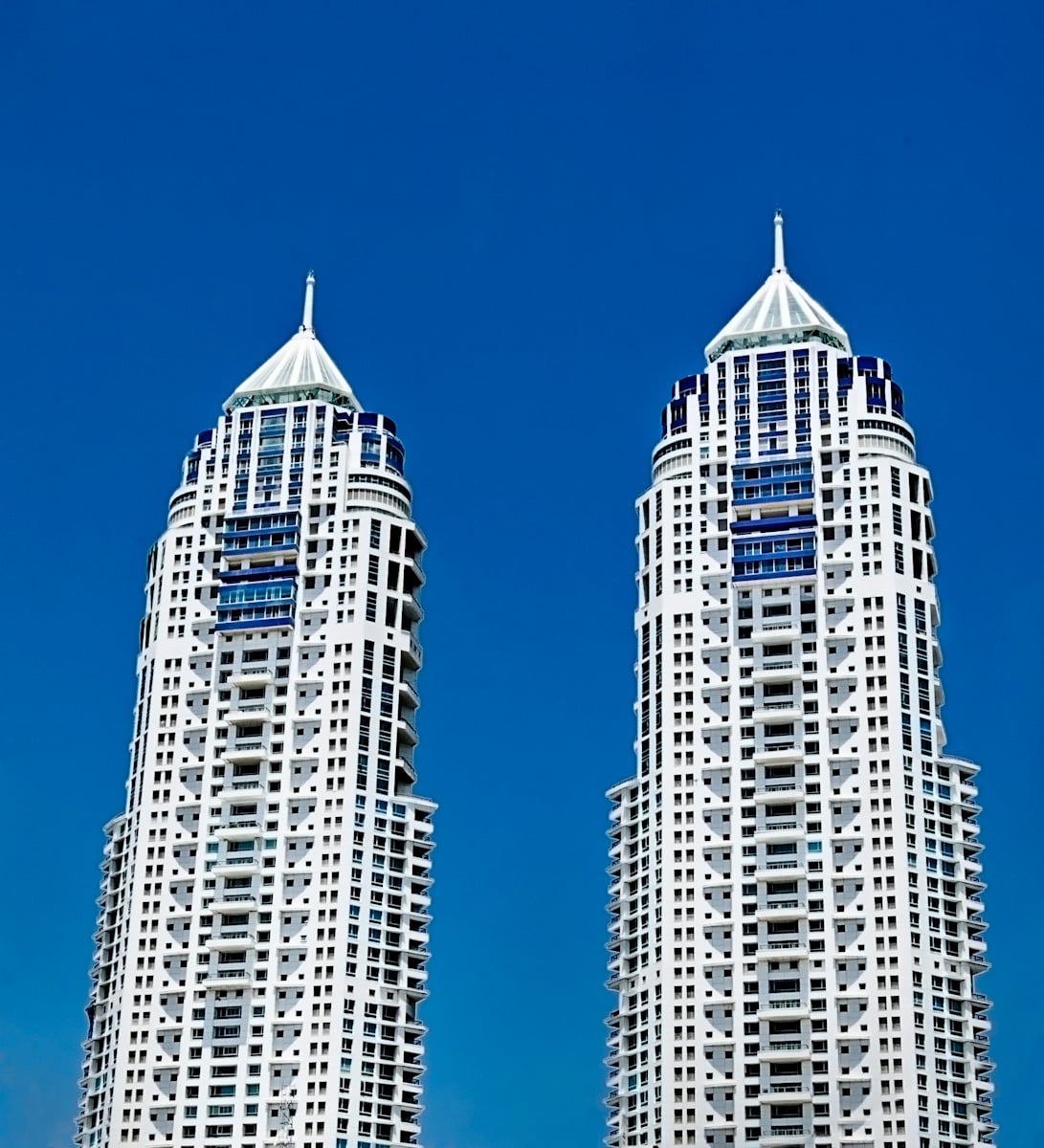 Twin Imperial Towers against a clear blue sky